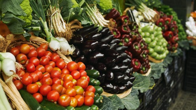Vegetables in basket market focus tomatoes