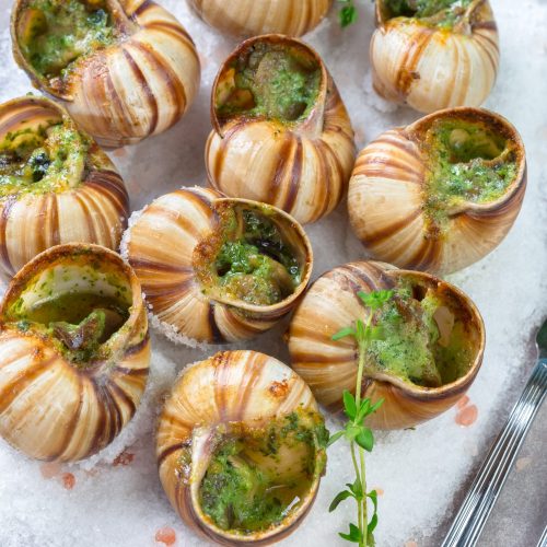 Baked snails with garlic butter and fresh herbs Baked snails with garlic butter and fresh herbs